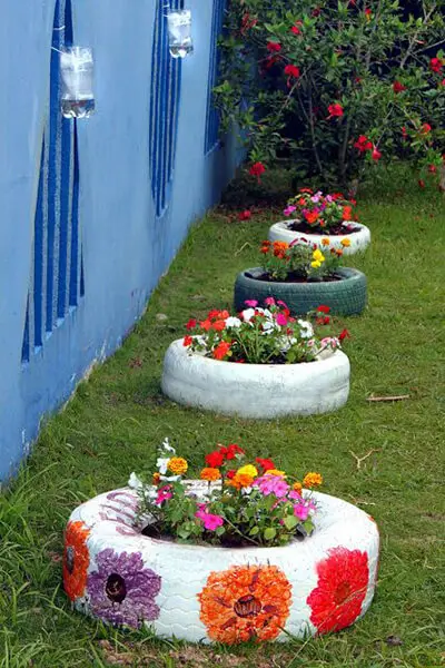 Crie floreiras com pneus pintados