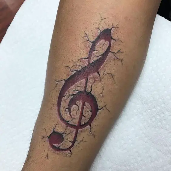 Tatuagens Femininas no Braço realista de nota musical